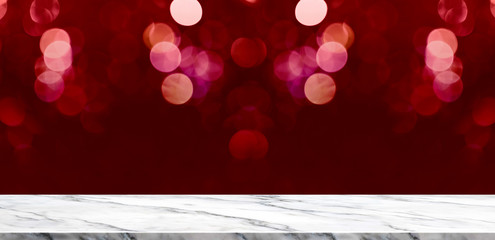 Empty marble table with sparkling red bokeh lights background,Holiday greeting card concept.Mock up template for display or montage of product,Valentine abstract backdrop.