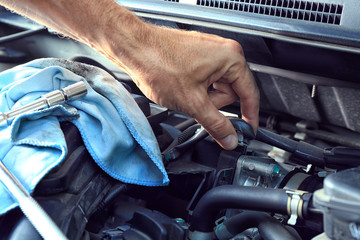 Wall Mural - Car mechanic providing car service, closeup