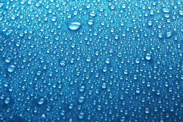 Wall Mural - Water drops on car window, closeup