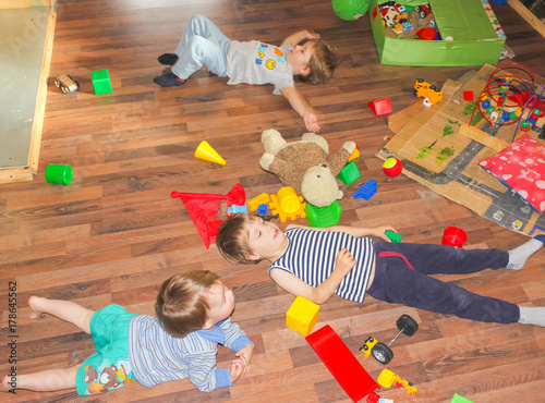 Children Lie On The Floor Among The Toys The Children Made The