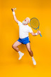 © deagreez - Competetive best cool healthy modern successful active grandpa with big tennis equipment raised in hand up. Healthcare, weight loss, bodycare lifestyle, motivation, activity, pride, hobby
