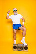 © deagreez - Crazy aged serious athlete pensioner grandpa in eyewear, sneakers, sexy shorts, with bass clipping ghetto blaster recorder. Old school, swag, fooling around, gym, workout, technology