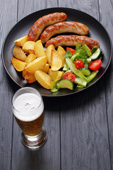 Poster - grilled sausages, baked potatoes and beer