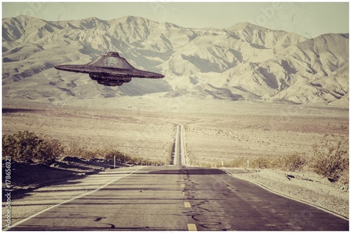 ufo flying over the desert Canvas Print