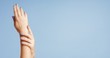 © Anastasia - Clean well manicured hands of a young woman, applying hand cream, skin care on light blue background