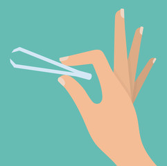 Woman's hand holding tweezers