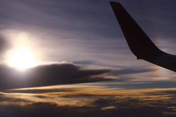 Wall Mural - Sunset White Cloud sky at high level attitude, view from window airplane