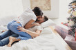 © Gennady Danilkin - A loving couple celebrates Christmas together. Lovers on a loft bed.