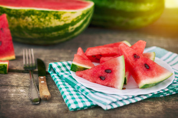 Wall Mural - Watermelon pieces on plate with cutlery