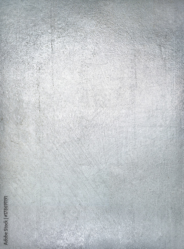Fotografía Worn metal plate steel background. Silver foil.