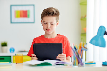Wall Mural - student boy with tablet pc and notebook at home