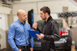 © Syda Productions - auto mechanic and customer at car shop