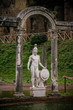 Details of the archaeological site of Villa Adriana with its central fountain and statues depicting Roman deities
