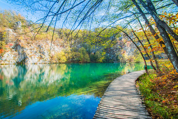 Beautiful landscape, clear green water and wooden path in the Plitvice Lakes National Park in Croatia 