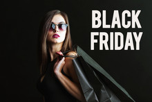 Elegant Brunette Woman Wears Sunglasses And Black Dress Holding Black Shopping Bags, Black Friday Concept