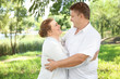 © Africa Studio - Overweight couple in park on sunny day