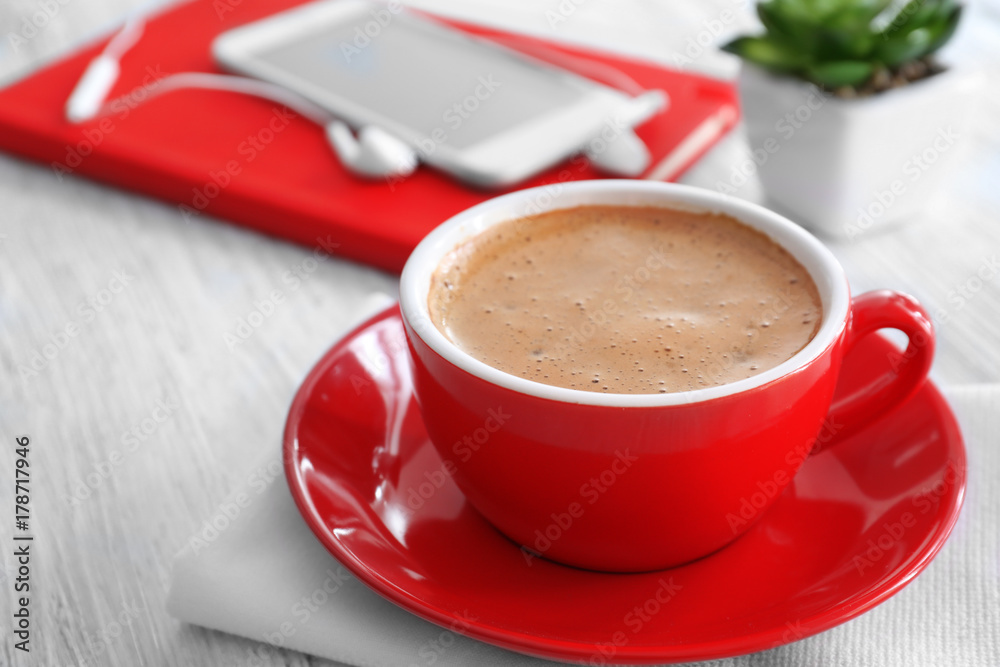 Cup of aromatic morning coffee on wooden table