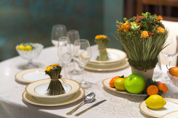 Beautiful table set with flowers for a festive event, party or wedding reception