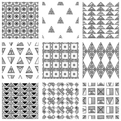 Wall Mural - Seamless vector pattern. Black and white geometrical background with hand drawn decorative tribal elements. Print with ethnic, folk, traditional motifs. Graphic vector illustration.