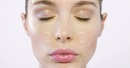 futuristic and technological scanning of the face of a beautiful woman for facial recognition and sc