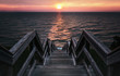 Surreal Sunset Stairway to the Sea. Low Key Vintage Style with Copy Space.