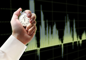 Wall Mural - Candlestick chart graphic and stopwatch in hand