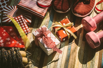 Canvas Print - Still life of Merry Christmas and Happy new year and any holidy present boxes for healthy and active lifestyle concepts vintage retro tone. Composition with dumbbells, sport shoes, skipping rope