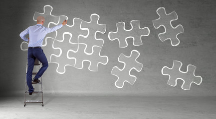 Poster - Businessman searching puzzle solution on a wall 3D rendering