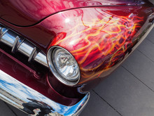 Classic American Custom Muscle Car With Flames Painted Behind Headlight