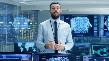 Fototapete - In the World's Top Machine Learning Facility Scientist Excitedly Describes Project He Works on. Background Shows Screens with Working Neural Network/ Artificial Intelligence. 