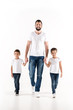 © LIGHTFIELD STUDIOS - father and kids holding hands