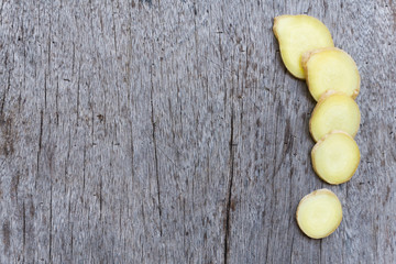 Sticker - Closeup ginger roots with wood background, coppy space for text or ginger product concept