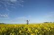 © Judah - Person Standing in Canola Field