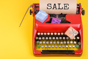 Poster - Holidays concept - red typewriter with craft paper with text 