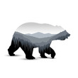 Silhouette of bear with panorama of mountains. Grey tones.