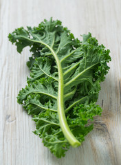 Sticker - kale on white wooden surface