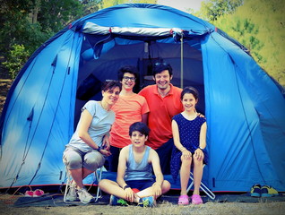 five-person family with three children with camping tent