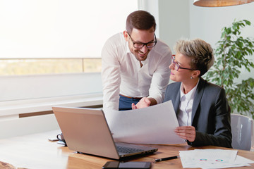 Canvas Print - Two people working in the office  