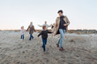 © LIGHTFIELD STUDIOS - multigenerational family on seashore