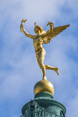 Wall Mural - Gilded statue Genie de la Liberte at July Column on Bastille Square. Place de la Bastille - square in Paris, where Bastille prison stood until 