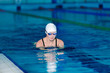 © Rychko Yevhen - woman swimming with swimming hat in swimming pool