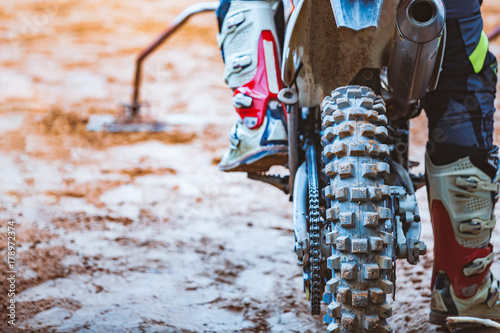Close-up of biker sitting on motorcycle in starting point before the start of th Fototapete