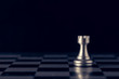 Chess on a chessboard at black background, Business leader concept. vintage tone.