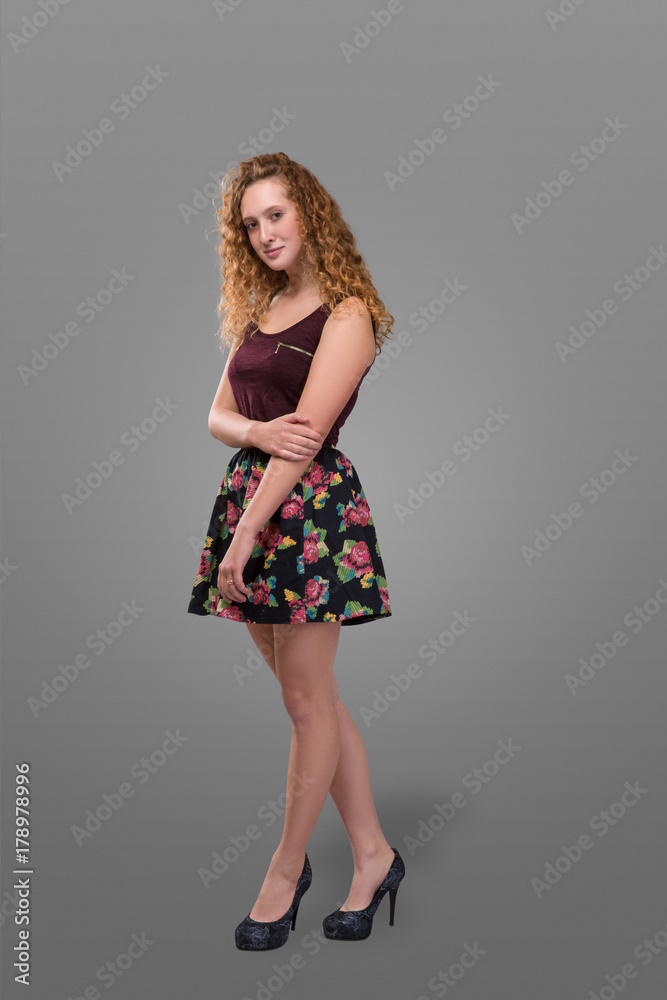 redhead short dress Photo Stock Redhead skinny girl in blue short dress and straw hat stay in front of huge maple in summer, view from back