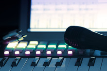 Blurred Closeup Of Music Recording Studio Instruments, With Gears For Electronic And Digital Music Composition. Blur And Instragram Colors Effect Applied. Background For Music Industry And Tech News.