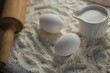 © wavebreak3 - Flour, eggs and rolling pin placed over butter paper