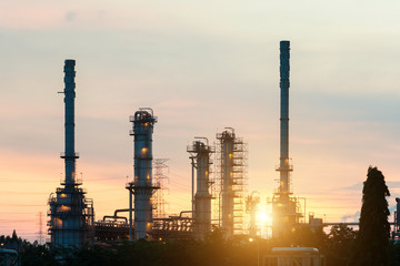 Landscape of oil refinery industry with oil storage tank in night.