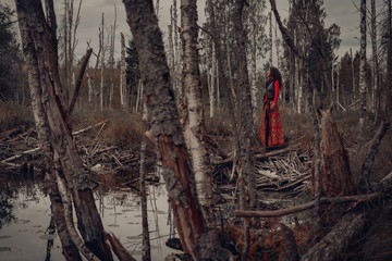 Wall Mural - attractive young woman in forest