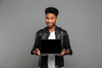 Sticker - Portrait of a young african man in leather jacket