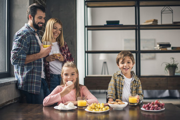 Wall Mural - family having breakfast at home